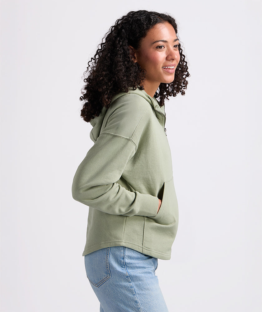 Sage scallop hem hoodie, side profile, hand in pocket